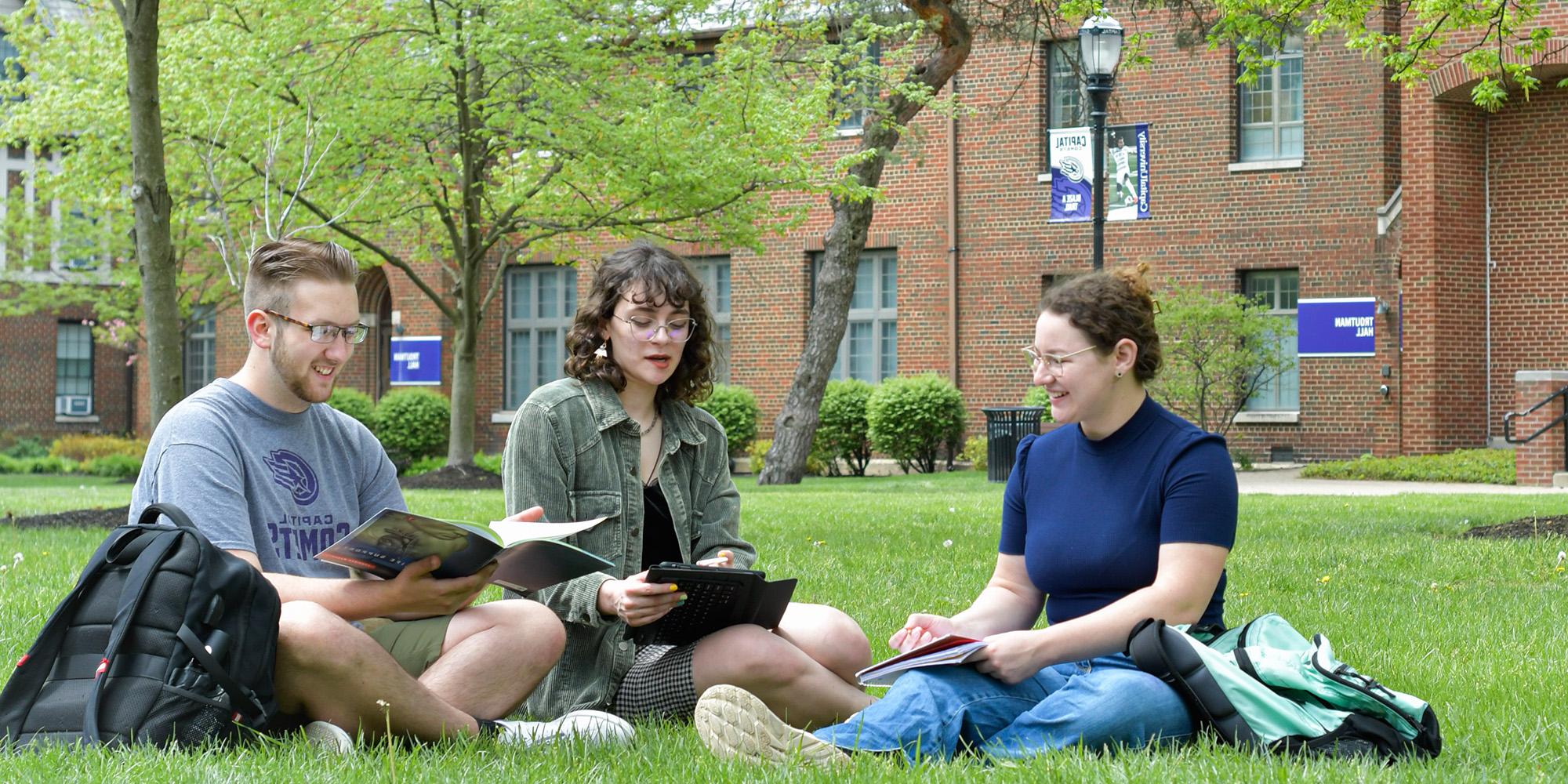 Students Sitting On 法律n In Quad (1)